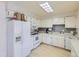 Functional kitchen with white appliances and ample cabinet space at 1576 S Ursula Ct, Aurora, CO 80012