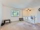 Spacious living room with carpet flooring, window, and ceiling fan at 1576 S Ursula Ct, Aurora, CO 80012