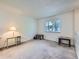 Inviting living room with neutral carpet and natural light from the window at 1576 S Ursula Ct, Aurora, CO 80012