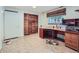 Home office features a desk, window with blinds, and closet at 1576 S Ursula Ct, Aurora, CO 80012