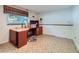 Home office with desk, window with blinds, and linoleum floors at 1576 S Ursula Ct, Aurora, CO 80012