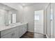 Double vanity bathroom with a large mirror and walk-in shower at 1386 Bloom St, Brighton, CO 80601