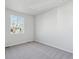 Well-lit bedroom with gray carpet and a window at 1386 Bloom St, Brighton, CO 80601