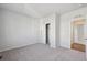 Spacious bedroom with gray carpet and a walk-in closet at 1386 Bloom St, Brighton, CO 80601