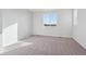 Well-lit bedroom featuring neutral carpeting and ample natural light at 1386 Bloom St, Brighton, CO 80601