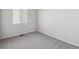 Simple bedroom with gray carpet and a window at 1386 Bloom St, Brighton, CO 80601