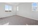 Spacious bedroom with neutral carpeting and large windows at 1386 Bloom St, Brighton, CO 80601