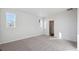 Bright bedroom with carpeted floor and large window at 1386 Bloom St, Brighton, CO 80601