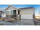 Modern two-story home with gray siding and a two-car garage at 1386 Bloom St, Brighton, CO 80601