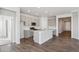 Modern kitchen with gray cabinets, island, and stainless steel appliances at 1386 Bloom St, Brighton, CO 80601