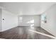 Spacious living room with vinyl flooring and large windows at 1386 Bloom St, Brighton, CO 80601