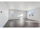 Bright and spacious living room with hardwood floors and large windows at 1386 Bloom St, Brighton, CO 80601