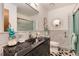 Clean bathroom with a single sink and shower/tub combo at 4696 S Yates St, Denver, CO 80236