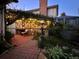 Evening view of a charming garden patio at 4696 S Yates St, Denver, CO 80236