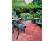 Secluded garden patio with a brick walkway at 4696 S Yates St, Denver, CO 80236