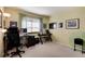 Home office with a desk, chair, and ample natural light at 4696 S Yates St, Denver, CO 80236