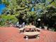 Circular patio with stone table and benches at 4696 S Yates St, Denver, CO 80236