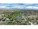 Overhead view showcasing the property's location near a scenic park, pond, and the distant mountains at 6735 W 2Nd Ave, Lakewood, CO 80226