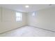 Unfinished basement bedroom featuring a marble-style floor and natural light at 6735 W 2Nd Ave, Lakewood, CO 80226