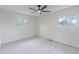 Bedroom with neutral carpet, white walls, two windows and plenty of natural light at 6735 W 2Nd Ave, Lakewood, CO 80226