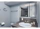 Bathroom with mirrored cabinet and tile countertop at 22598 Westview Ave, Golden, CO 80401