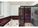 Modern bathroom with shower and tub with decorative tile at 22598 Westview Ave, Golden, CO 80401