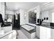 Modern bathroom with a soaking tub, walk-in shower, and unique vanity lighting at 22598 Westview Ave, Golden, CO 80401