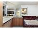 Bathroom with tub, double sinks, and mirrored cabinets at 22598 Westview Ave, Golden, CO 80401