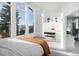 Sun-filled bedroom featuring a king-size bed, mountain views, and modern design elements at 22598 Westview Ave, Golden, CO 80401