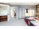 Bedroom with open door to bathroom, closet, and modern finishes at 22598 Westview Ave, Golden, CO 80401