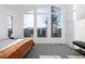 Bright bedroom featuring large windows with mountain views, light gray carpet, and white walls at 22598 Westview Ave, Golden, CO 80401