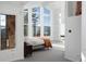 Bright bedroom with tall windows offering scenic views, complemented by minimalist decor at 22598 Westview Ave, Golden, CO 80401