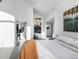 Bright bedroom with an en suite bathroom, modern décor, a large window with a view, and artwork at 22598 Westview Ave, Golden, CO 80401