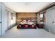 Bright bedroom with rustic wood accent wall, modern carpet, and ample closet storage at 22598 Westview Ave, Golden, CO 80401