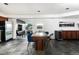 Open dining room with stone tile floors, picture window, and modern decor and lighting at 22598 Westview Ave, Golden, CO 80401