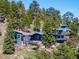 Stunning exterior of the home surrounded by lush trees and greenery at 22598 Westview Ave, Golden, CO 80401