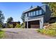 Detached two-car garage with wooden doors and ample parking space at 22598 Westview Ave, Golden, CO 80401