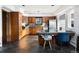 Spacious kitchen featuring wood cabinets, stone floors, a center island, and stainless steel appliances at 22598 Westview Ave, Golden, CO 80401
