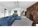Inviting living room boasts a stone fireplace, plush sofa, and an open staircase at 22598 Westview Ave, Golden, CO 80401