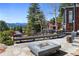 Outdoor patio with stone fireplace and mountain views at 22598 Westview Ave, Golden, CO 80401