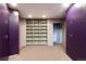 Spacious walk-in closet with shelving and customized purple storage at 22598 Westview Ave, Golden, CO 80401