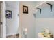 Bathroom featuring a white toilet and sports themed decor at 3141 S Tamarac Dr # 110G, Denver, CO 80231