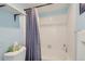 Bathroom featuring a shower/tub combination and purple patterned shower curtain at 3141 S Tamarac Dr # 110G, Denver, CO 80231