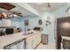 Modern kitchen with stainless steel appliances and updated countertops at 3141 S Tamarac Dr # 110G, Denver, CO 80231