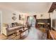 Living room with fireplace, sliding glass doors, and hardwood floors at 3141 S Tamarac Dr # 110G, Denver, CO 80231