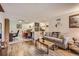 Inviting living room with hard surface floors and neutral color scheme at 3141 S Tamarac Dr # 110G, Denver, CO 80231