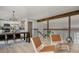 Open-concept dining area next to the stairs, kitchen, and living spaces at 8559 W 75Th Pl, Arvada, CO 80005