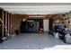 Well-organized garage with epoxy floors, storage cabinets, and tool racks at 8559 W 75Th Pl, Arvada, CO 80005
