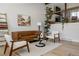 Bright living room with modern decor, hardwood floors, and large windows at 8559 W 75Th Pl, Arvada, CO 80005