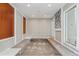 Unique basement area with tiered seating and a stone accent wall at 46 Douglas Dr, Broomfield, CO 80020